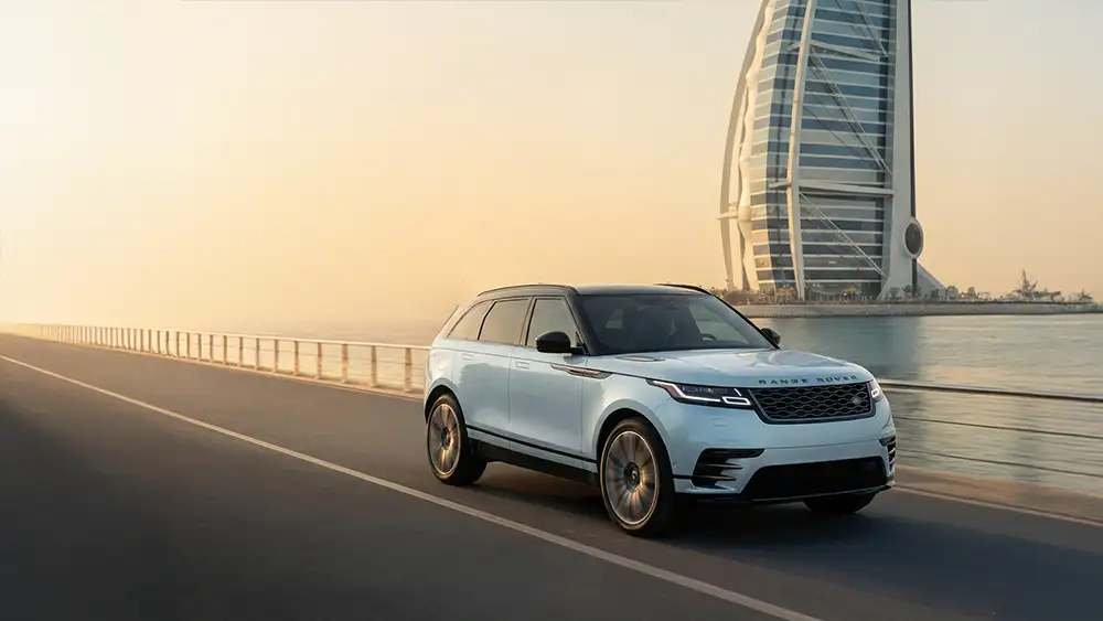 Happy customer receiving keys to a freshly maintained rental car